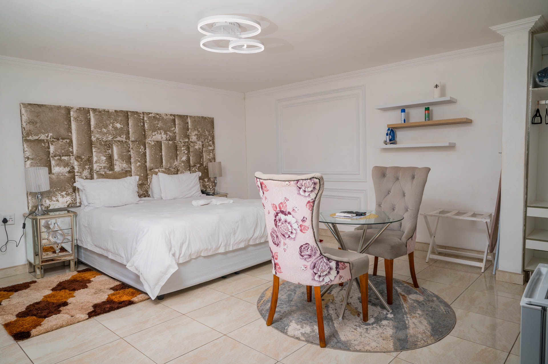 Deluxe Suite bedroom with comfortable bed and modern furnishings