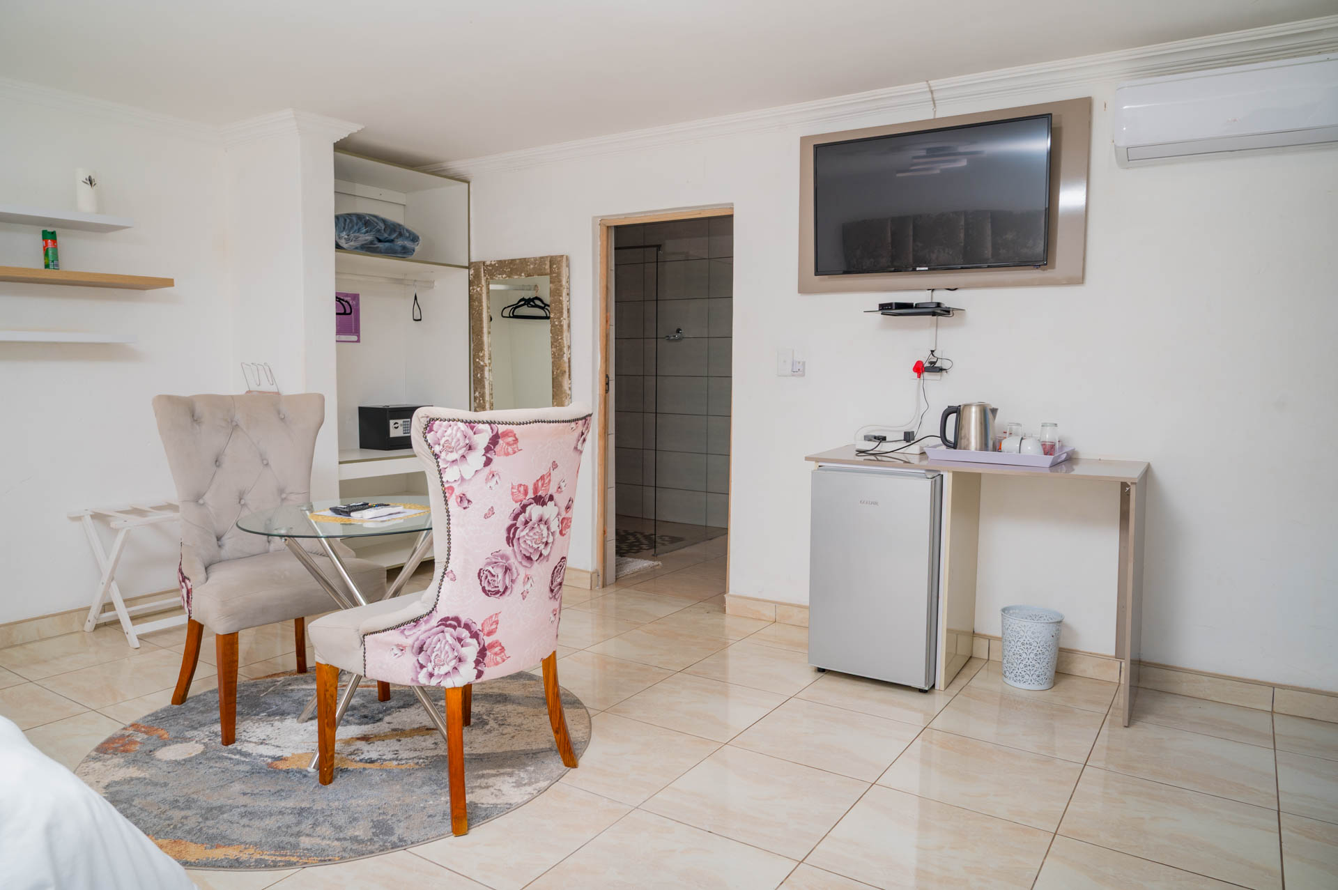 Deluxe Suite seating area with stylish décor and cozy ambiance