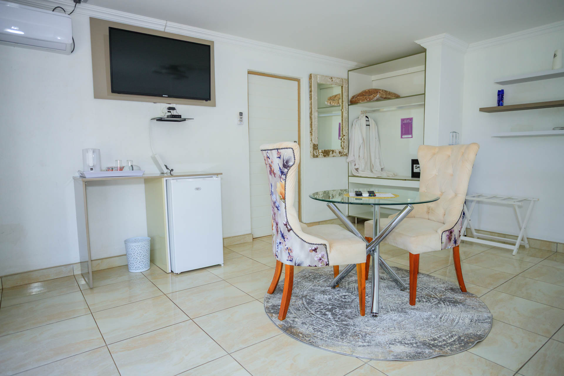 Deluxe Suite seating area with stylish décor and cozy ambiance